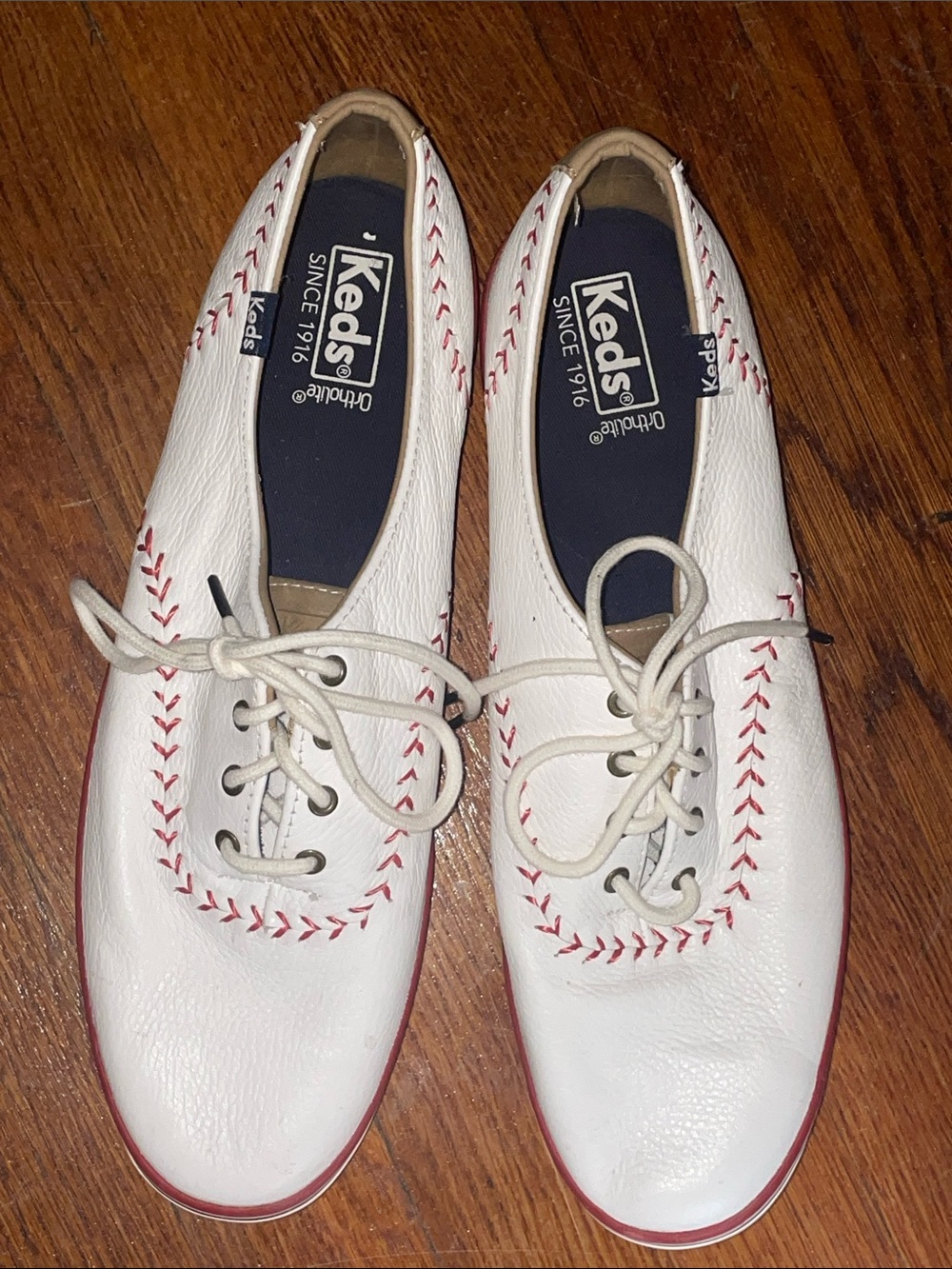 Keds women’s White Leather Sneakers with Red Stitching